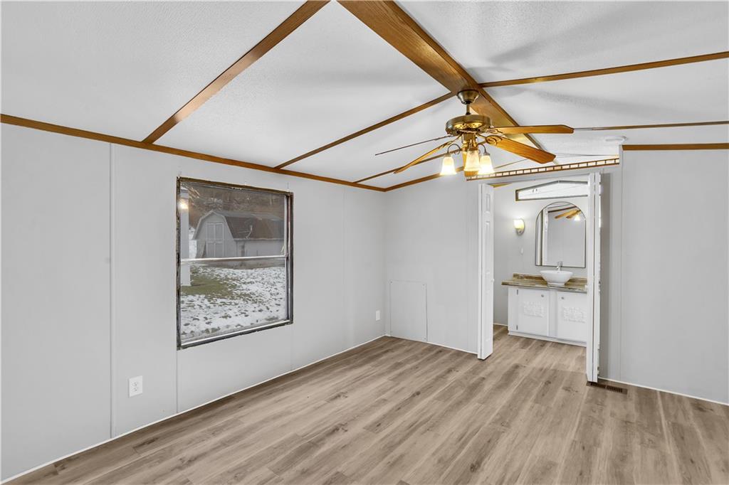 111 Dancer Lane Jeannette, PA 15644 - Photo 21 of 26 a view of a big room with wooden floor and windows