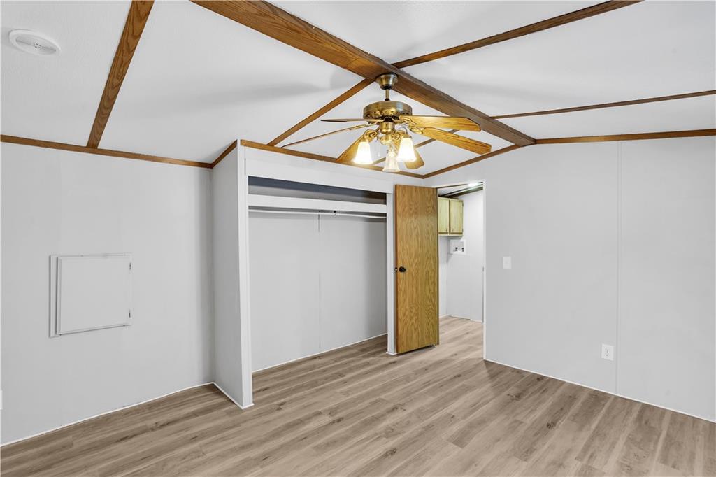 111 Dancer Lane Jeannette, PA 15644 - Photo 22 of 26 a view of empty room with wooden floor and fan