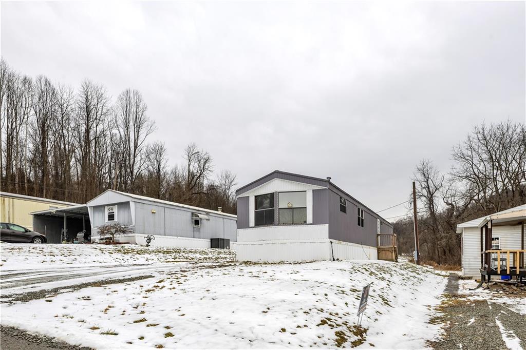 111 Dancer Lane Jeannette, PA 15644 - Photo 3 of 26 a house with a outdoor space