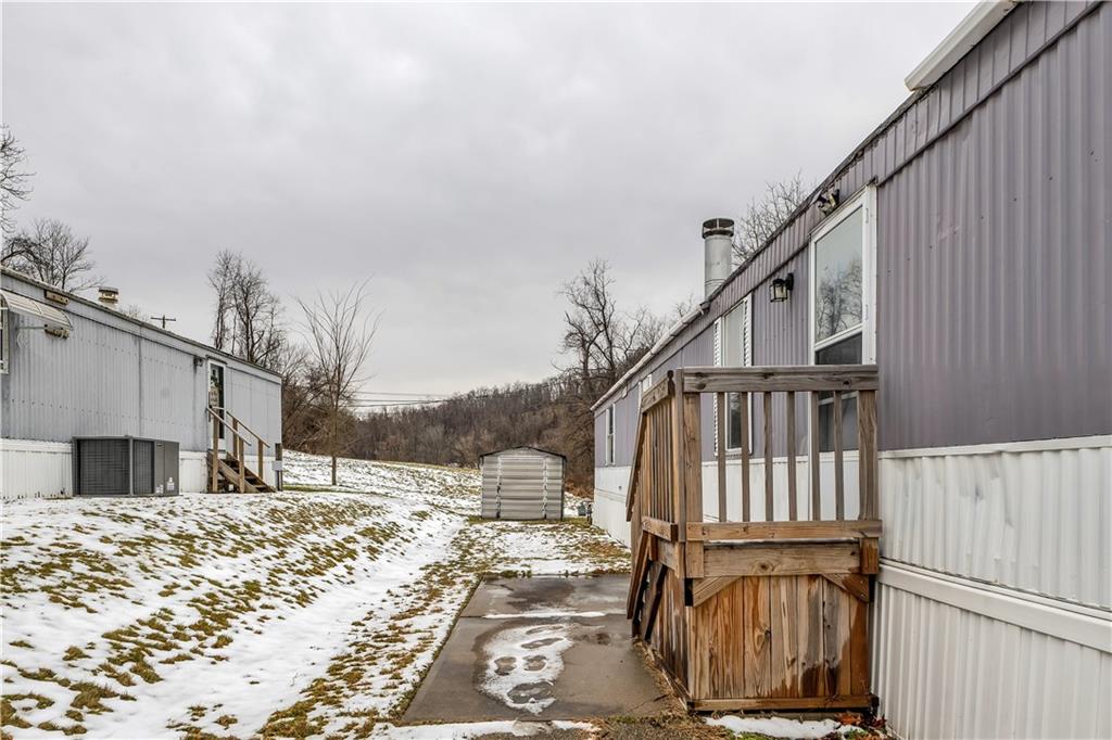 111 Dancer Lane Jeannette, PA 15644 - Photo 4 of 26 a view of wooden house with wooden floor and fence