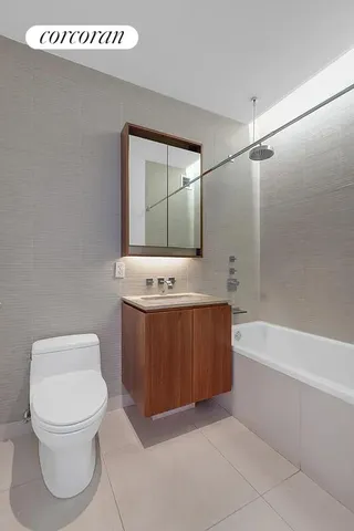 a bathroom with a sink a toilet and bathtub