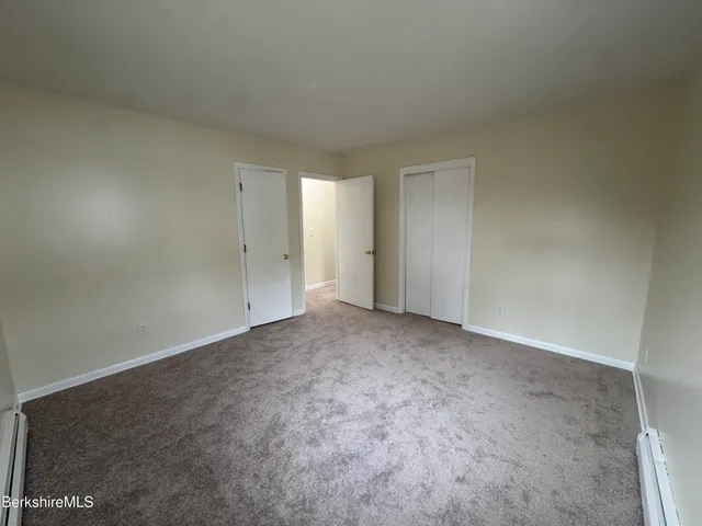 a view of an empty room and entryway