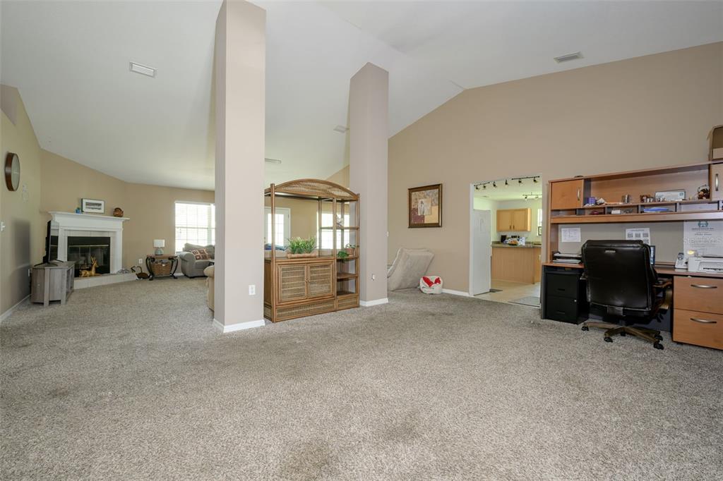 11 Riddle Drive Palm Coast, FL 32164 - Photo 12 of 33 a view of livingroom with furniture and fireplace