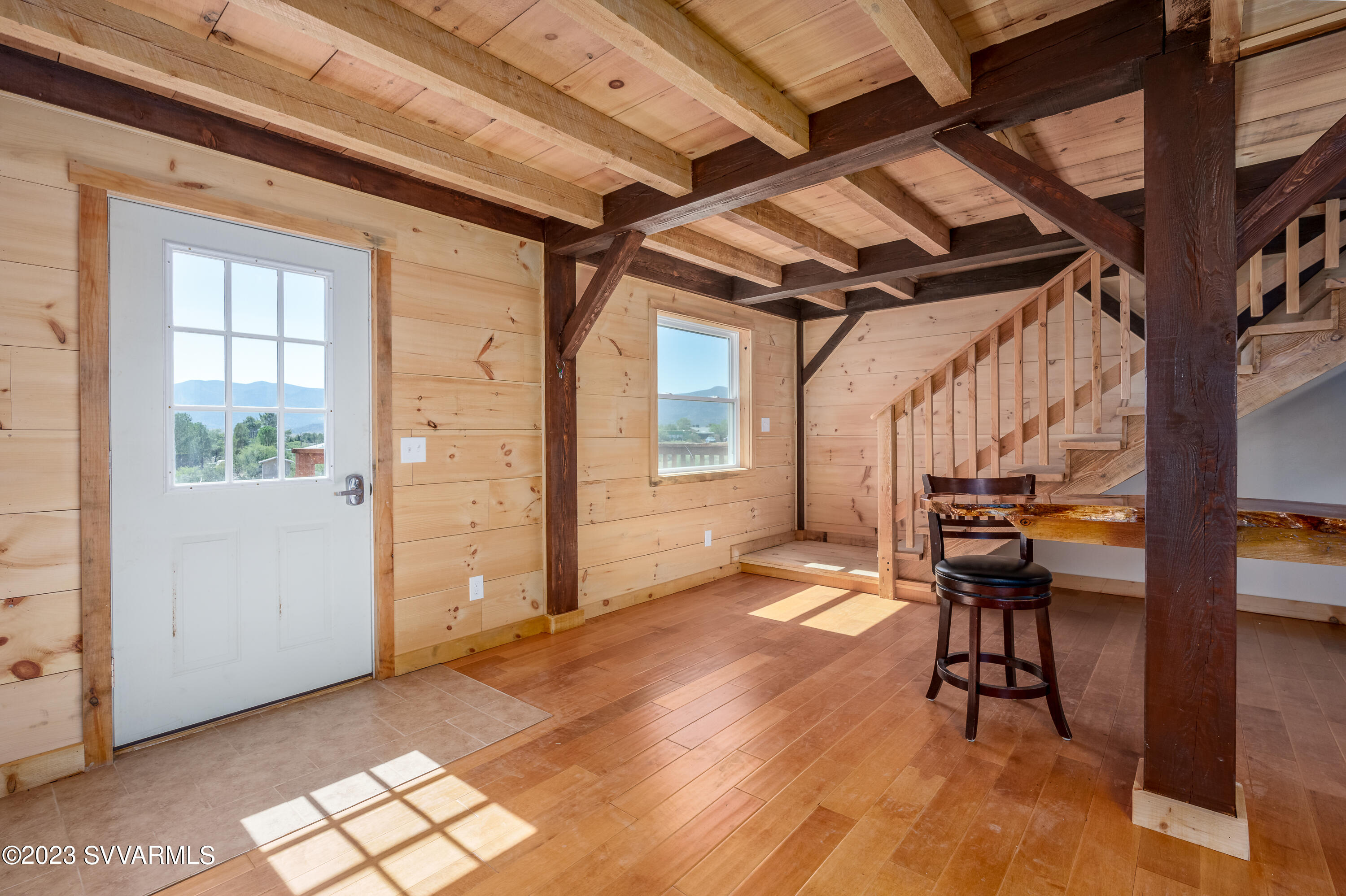 1652 Montezuma Heights Road Camp Verde, AZ 86322 - Photo 13 of 29 a view of an empty room with wooden floor and a window