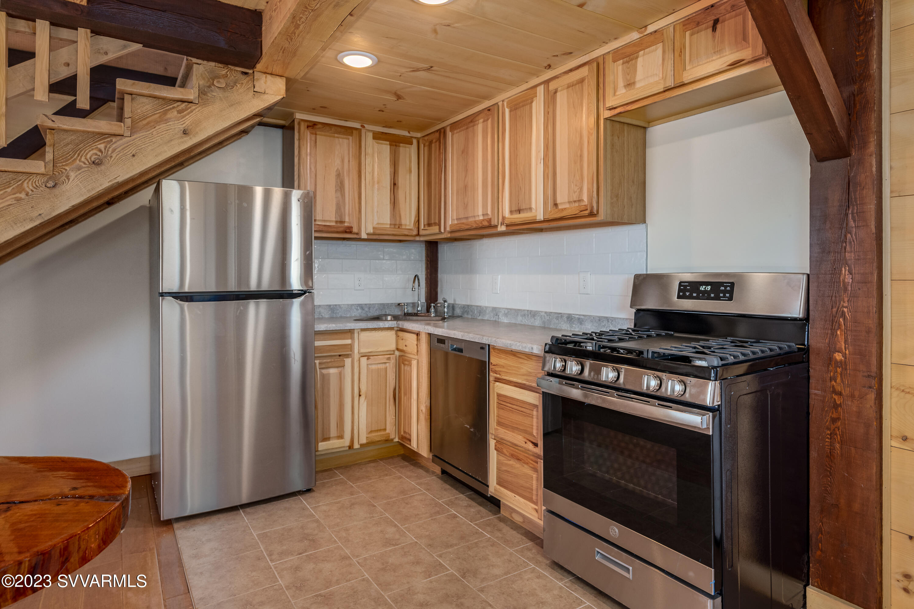1652 Montezuma Heights Road Camp Verde, AZ 86322 - Photo 15 of 29 a kitchen with stainless steel appliances granite countertop a stove a refrigerator and a microwave