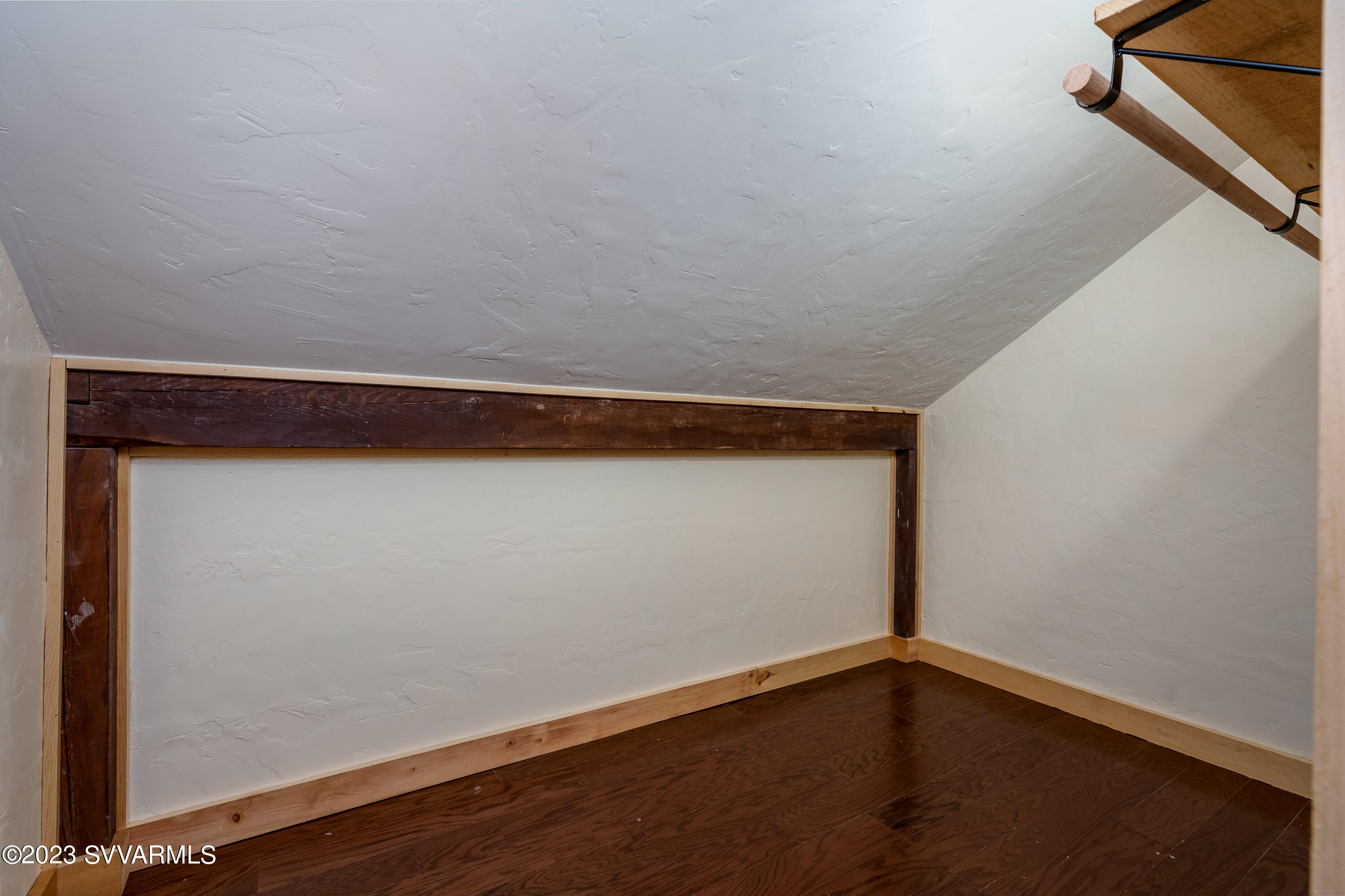 1652 Montezuma Heights Road Camp Verde, AZ 86322 - Photo 26 of 29 a view of an empty room with wooden floor