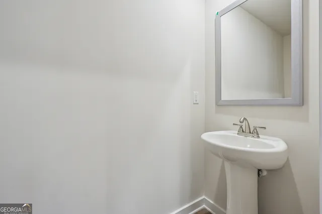 a bathroom with a sink and mirror