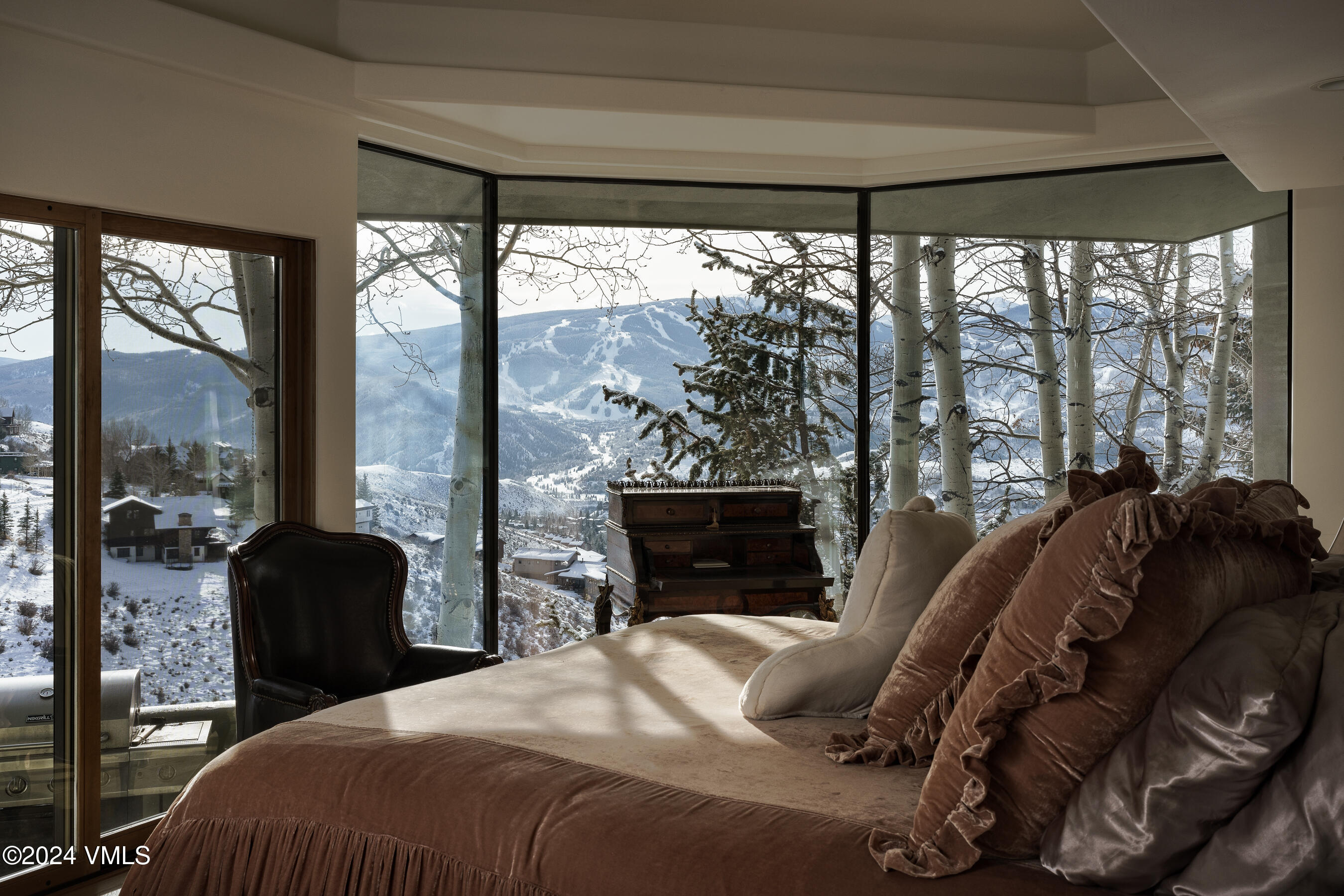 4747 Wildridge Road Avon, CO 81620 - Photo 13 of 51 a bedroom with a bed and wooden floor