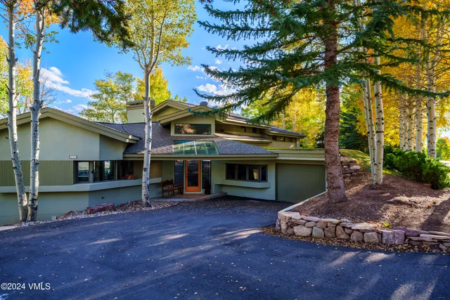 a living room with furniture fireplace and flat screen tv