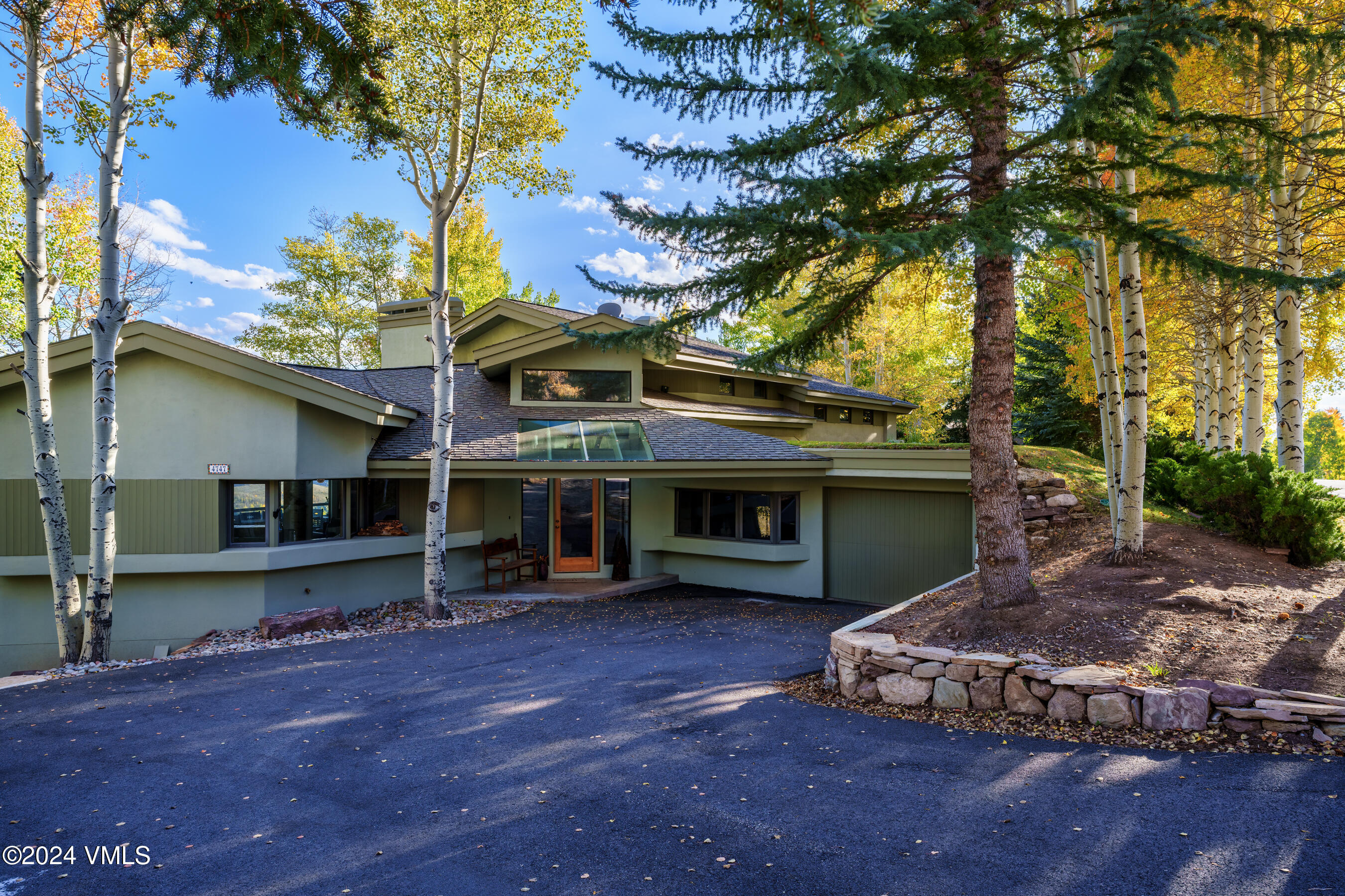 4747 Wildridge Road Avon, CO 81620 - Photo 14 of 51 a view of a house with a yard and wooden fence