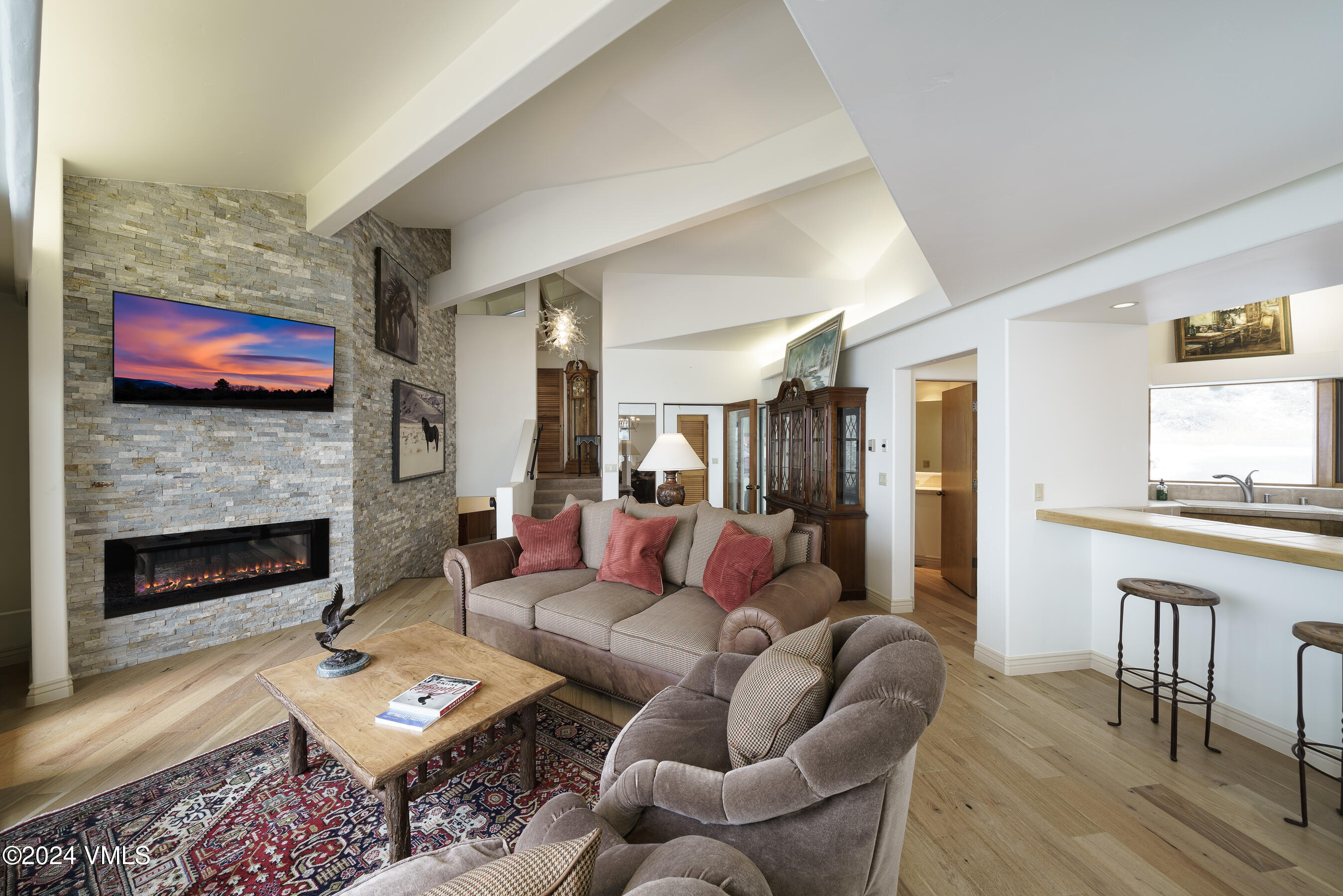 4747 Wildridge Road Avon, CO 81620 - Photo 15 of 51 a living room with furniture fireplace and dining table