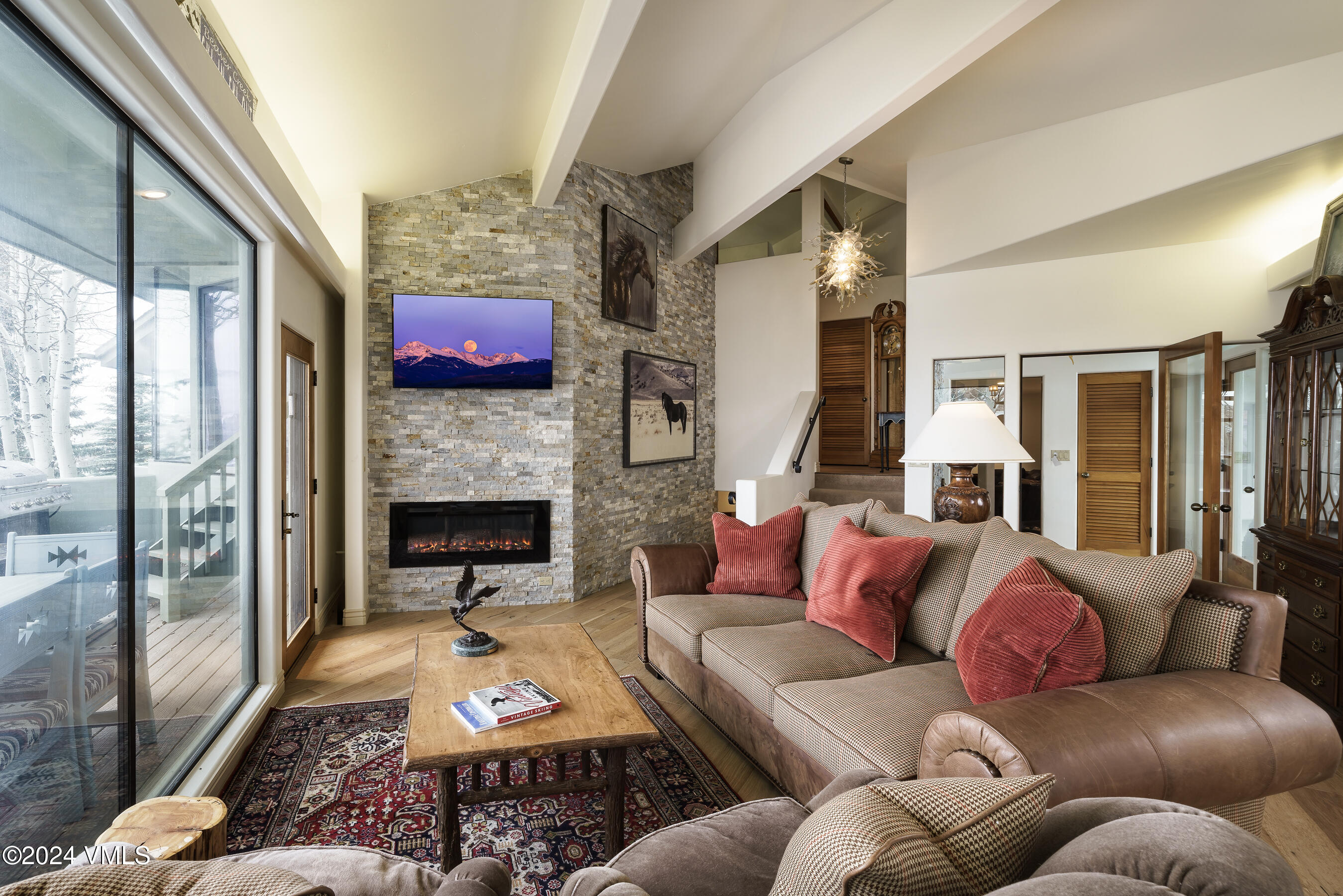 4747 Wildridge Road Avon, CO 81620 - Photo 17 of 51 a living room with furniture fireplace and flat screen tv