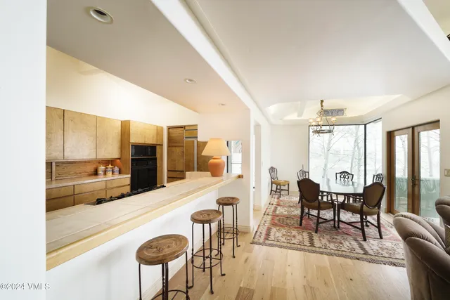 a bedroom with a bed and a view of kitchen