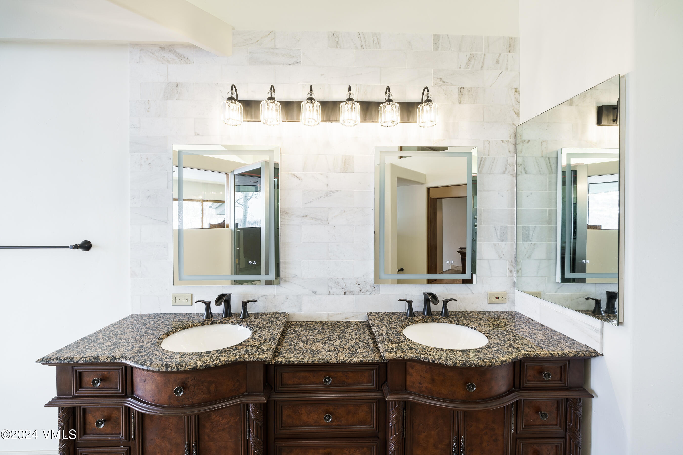 4747 Wildridge Road Avon, CO 81620 - Photo 29 of 51 a bathroom with a granite countertop sink and a mirror