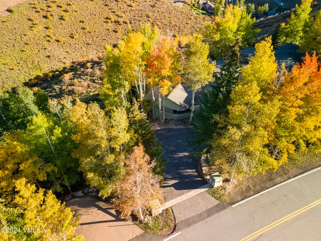 a backyard of a house with large trees