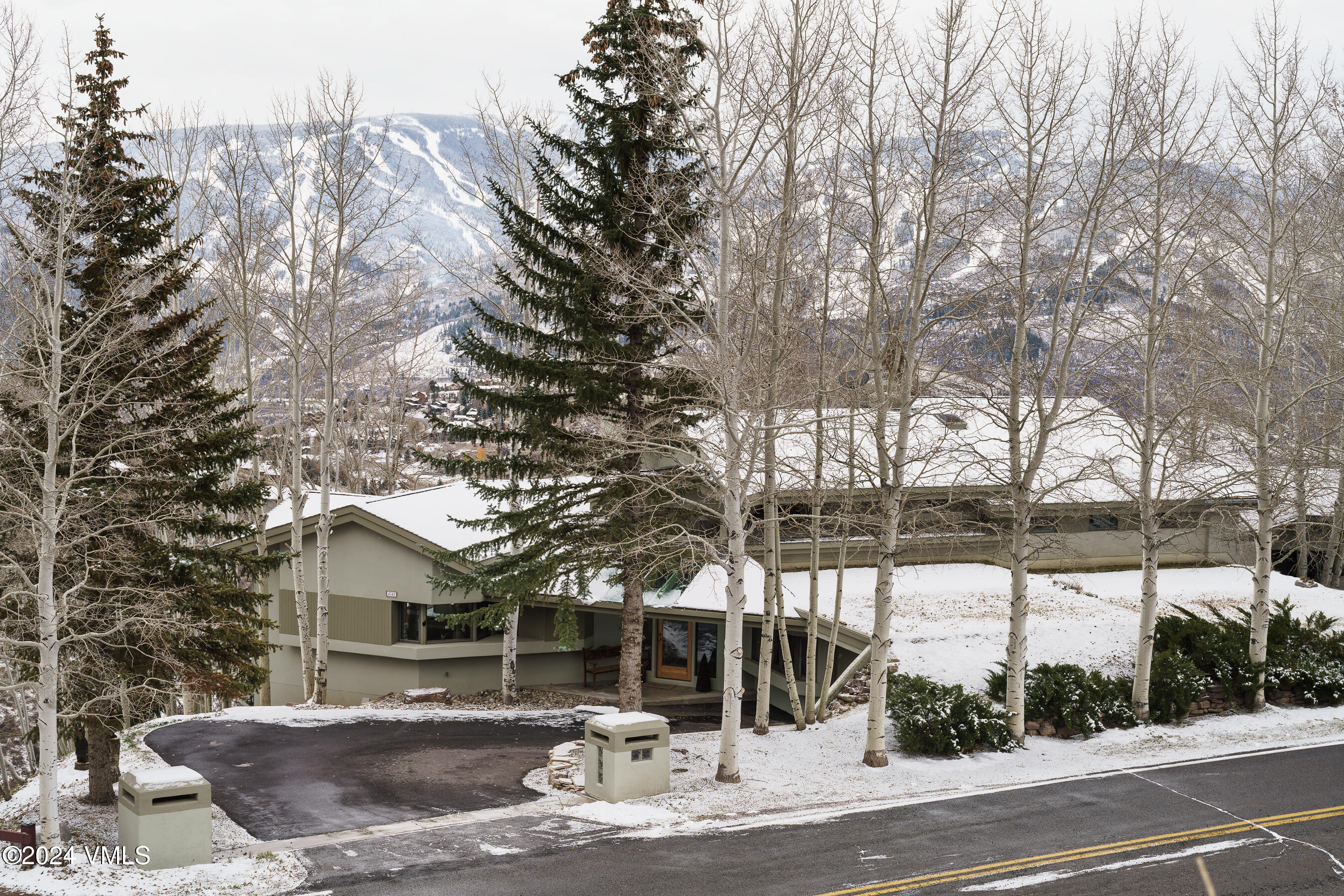 4747 Wildridge Road Avon, CO 81620 - Photo 49 of 51 a view of a house with a yard and tree s