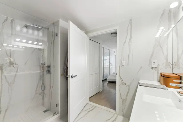 a bathroom with a tub and shower