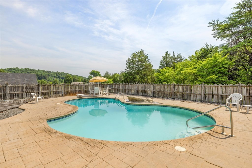 3221 Bryan Road Kodak, TN 37764 - Photo 20 of 31 a view of a swimming pool with a lounge chair
