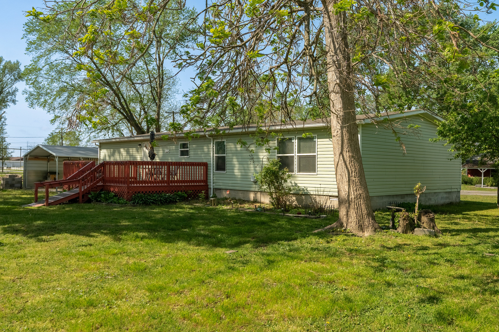 104 South Wells Street Du Quoin, IL 62832 - Photo 23 of 33 a view of backyard of house with wooden deck and seating space