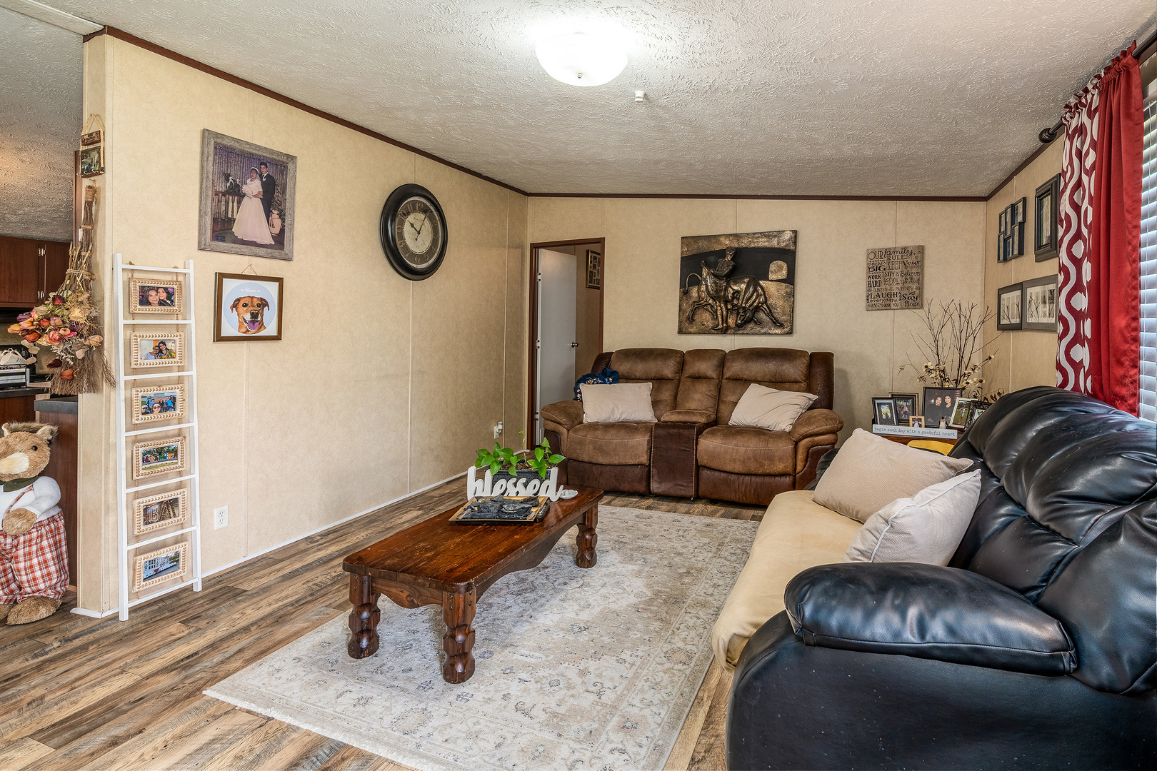 104 South Wells Street Du Quoin, IL 62832 - Photo 6 of 33 a living room with furniture a rug and wall paintings