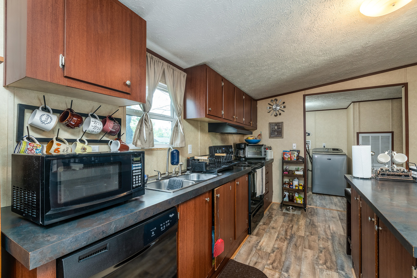 104 South Wells Street Du Quoin, IL 62832 - Photo 10 of 33 a kitchen with stainless steel appliances granite countertop a stove a sink and a refrigerator