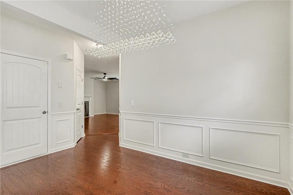 321 Lara Lane Hampton, GA 30228 - Photo 12 of 33 a view of an empty room and wooden floor