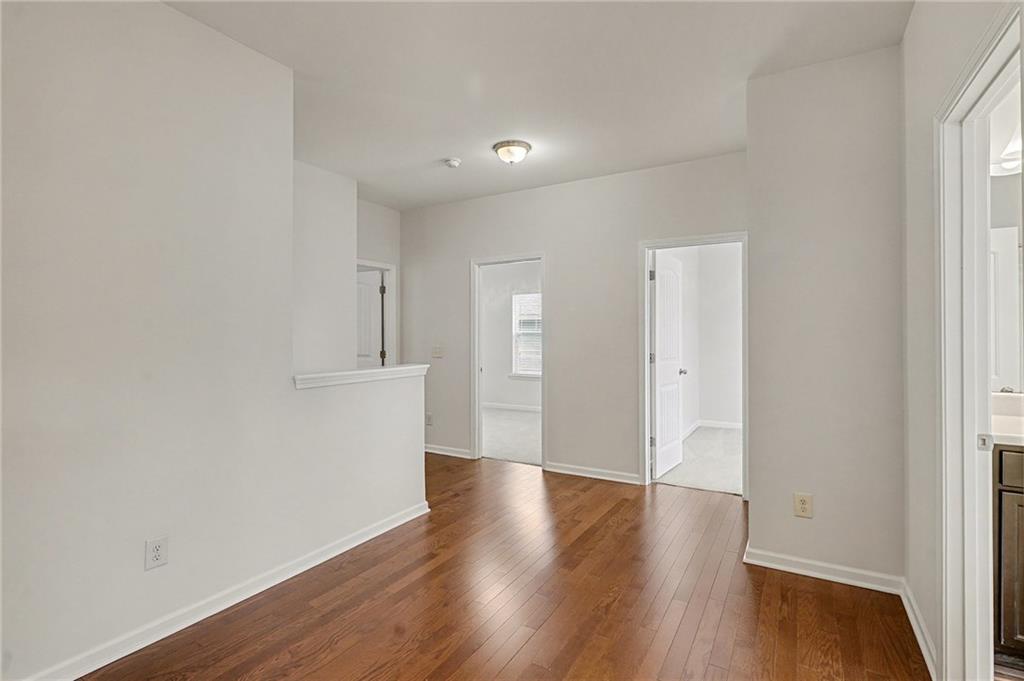 321 Lara Lane Hampton, GA 30228 - Photo 17 of 33 a view of a hallway with wooden floor