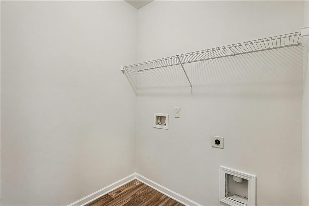 321 Lara Lane Hampton, GA 30228 - Photo 22 of 33 a view of a room with racks on the wall