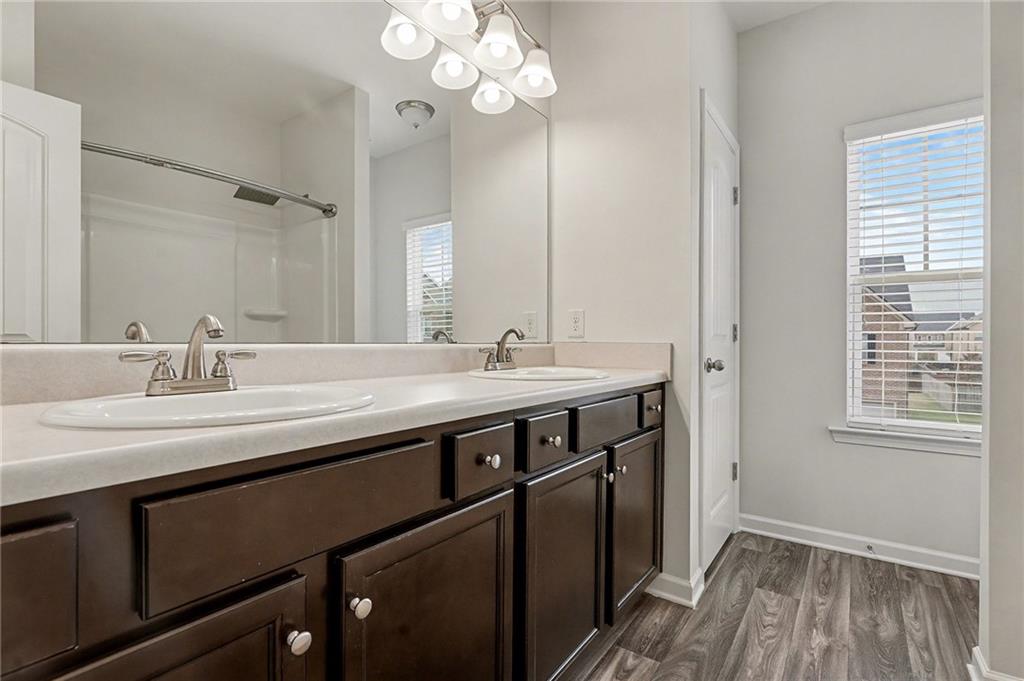 321 Lara Lane Hampton, GA 30228 - Photo 25 of 33 a sink with a vanity and mirror