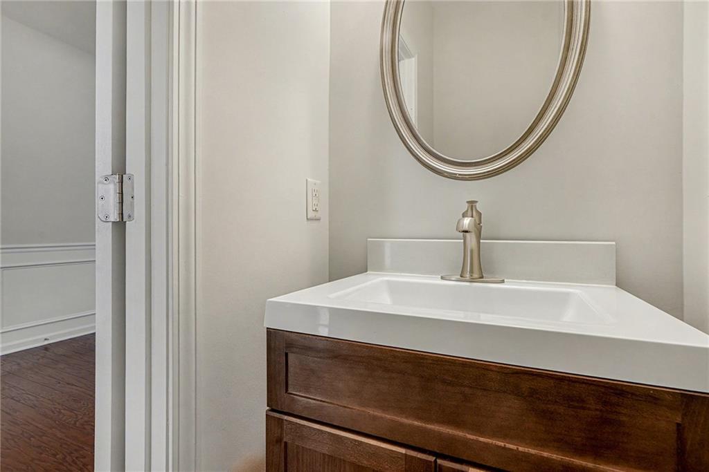 321 Lara Lane Hampton, GA 30228 - Photo 27 of 33 a bathroom with a sink and a mirror