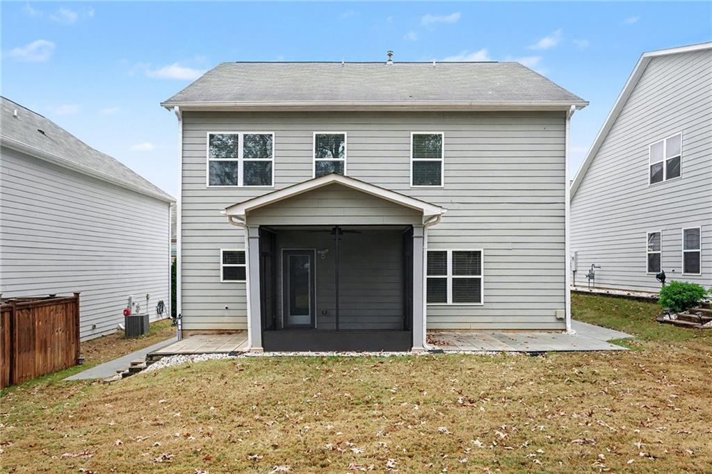 321 Lara Lane Hampton, GA 30228 - Photo 31 of 33 a front view of a house with a yard and garage