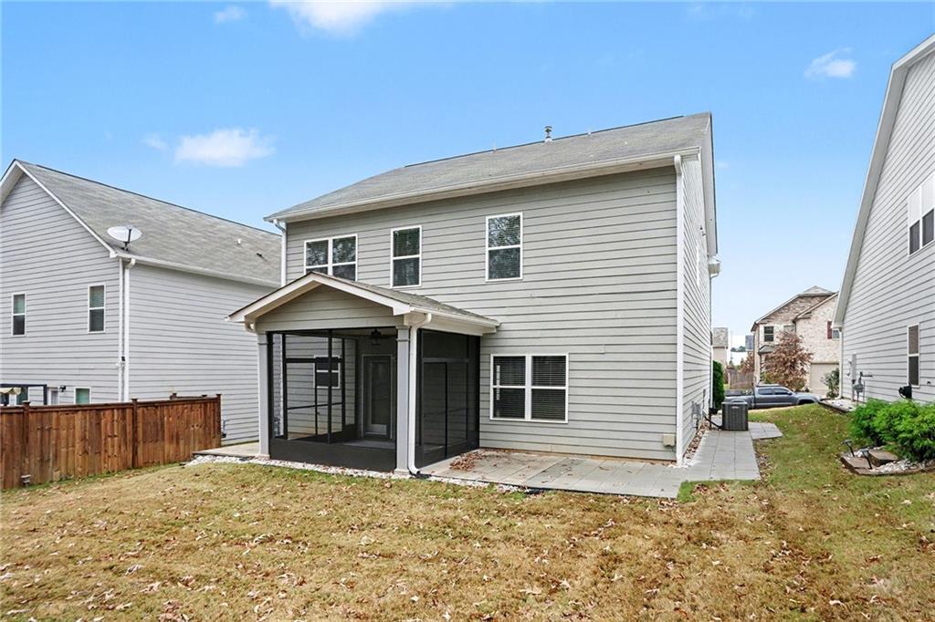 321 Lara Lane Hampton, GA 30228 - Photo 33 of 33 a front view of a house with a yard