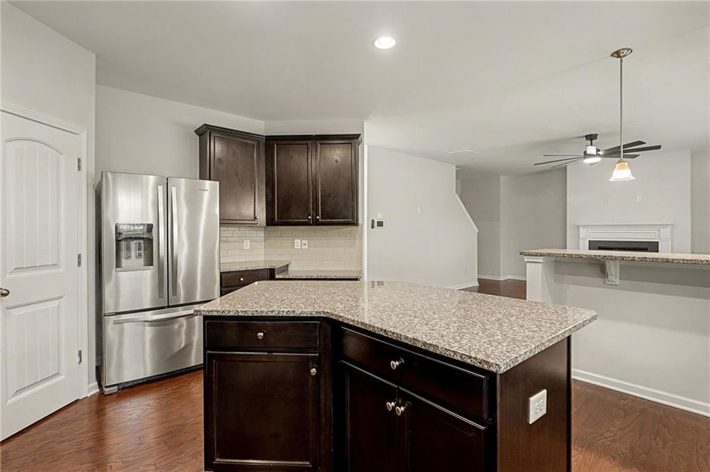 321 Lara Lane Hampton, GA 30228 - Photo 9 of 33 a kitchen with a refrigerator and a sink