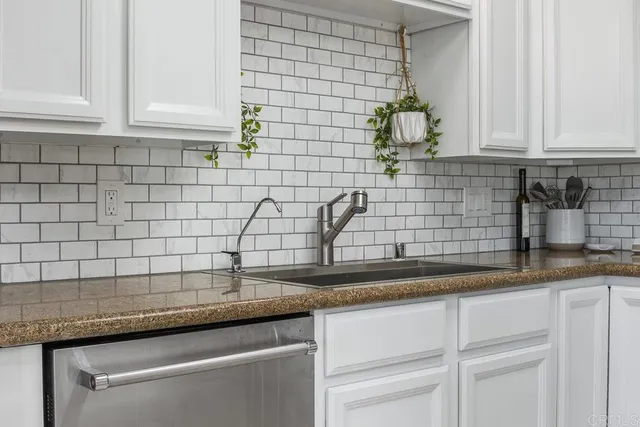 a view of a storage & utility room with a sink