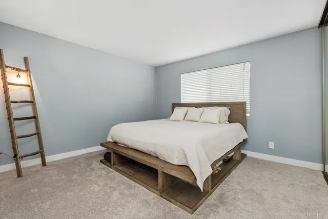 a room with gym equipment and a large window