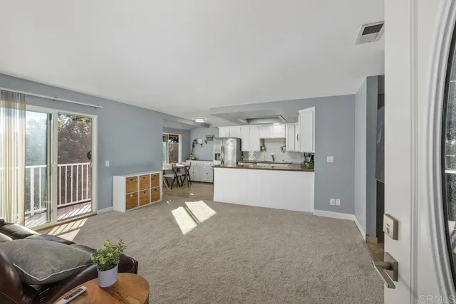 a spacious bedroom with a bed and a cabinets