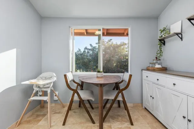 a kitchen with kitchen island granite countertop a refrigerator a sink a stove a microwave a sink and dishwasher