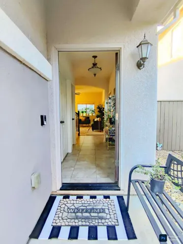 a bathroom with a glass door shower and a rug
