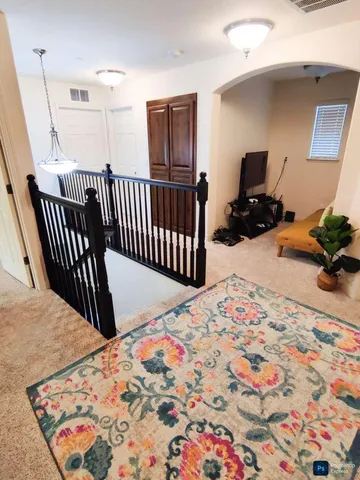 a bedroom with bed and wooden floor