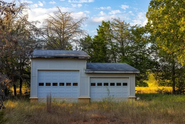 a view of a lake with houses in the back