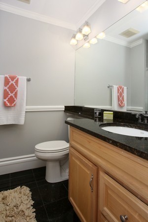235 Beacon Street, Unit 7 Boston, MA 02116 - Photo 6 of 7 a bathroom with a sink a toilet and a mirror