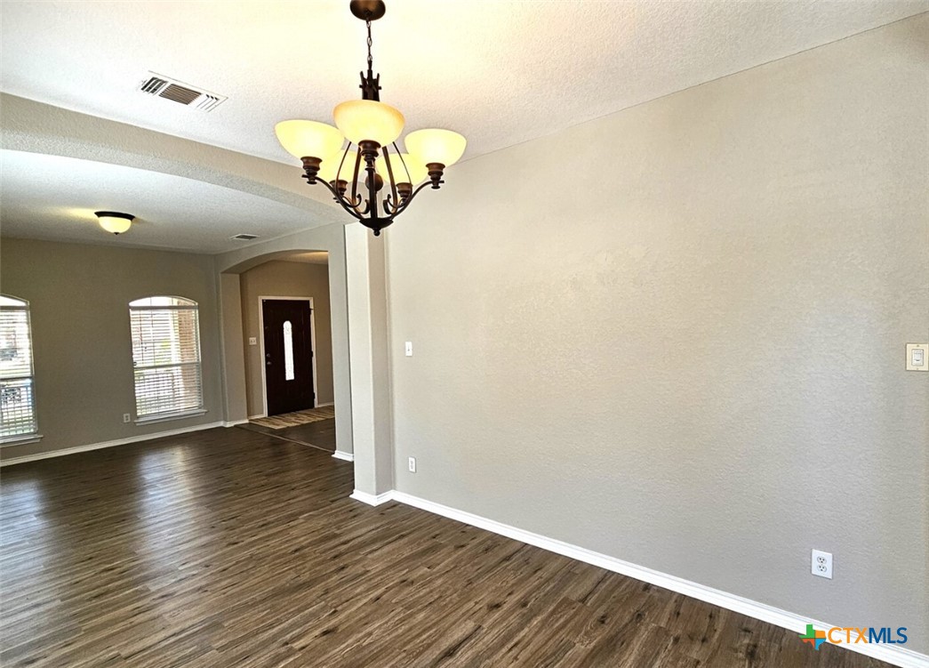 316 Julian Point Cibolo, TX 78108 - Photo 11 of 28 a view of livingroom with chandelier and wooden floor