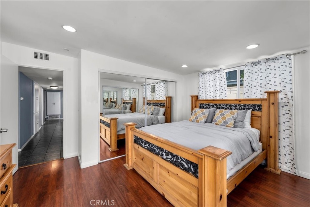 1733 East Dimondale Drive Carson, CA 90746 - Photo 17 of 43 a spacious bedroom with a bed and a wooden floor