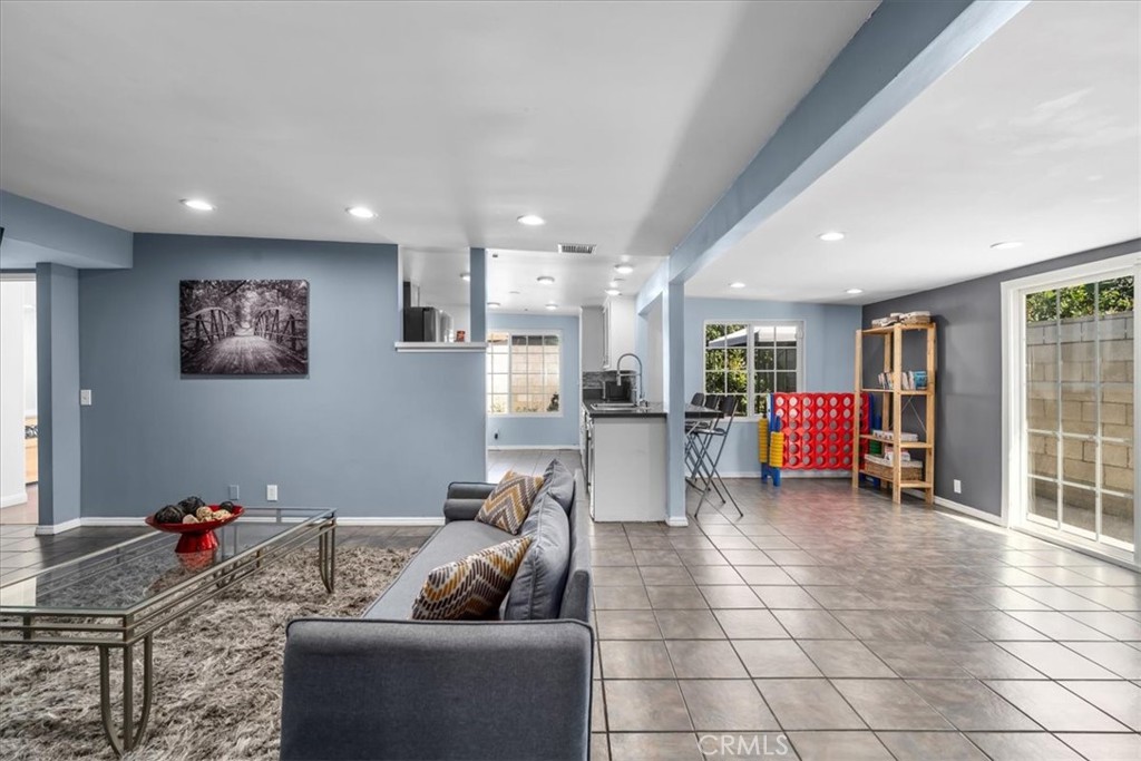 1733 East Dimondale Drive Carson, CA 90746 - Photo 9 of 43 a living room with furniture and a flat screen tv