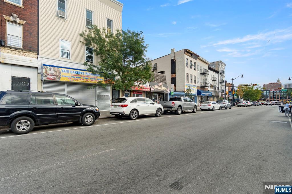 a view of a cars park in front of a building