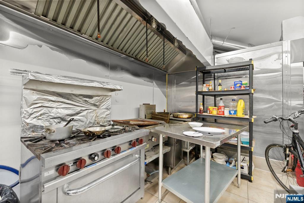 67 Broadway Newark, NJ 07104 - Photo 12 of 18 a stove top oven sitting inside of a kitchen