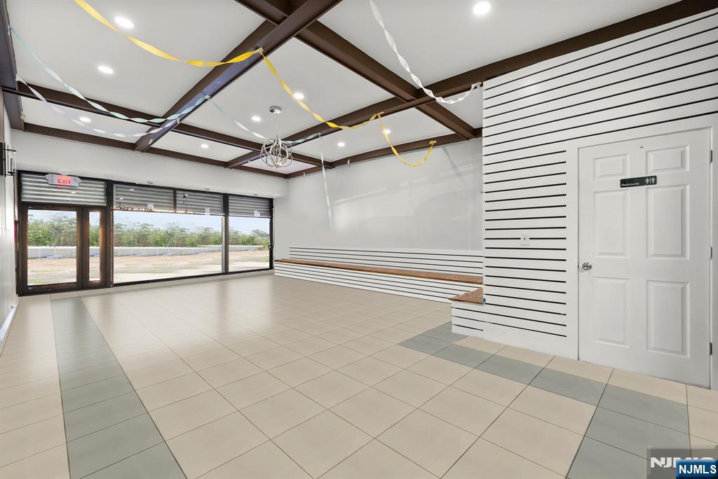 67 Broadway Newark, NJ 07104 - Photo 7 of 18 a view of an empty room with a window