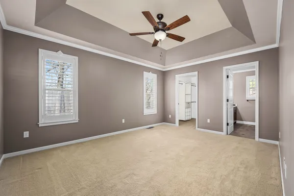 a bathroom with a tub shower and sink