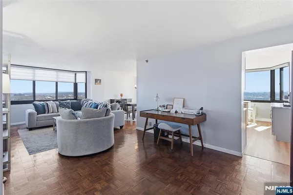 a view of a dining room with furniture window and wooden floor