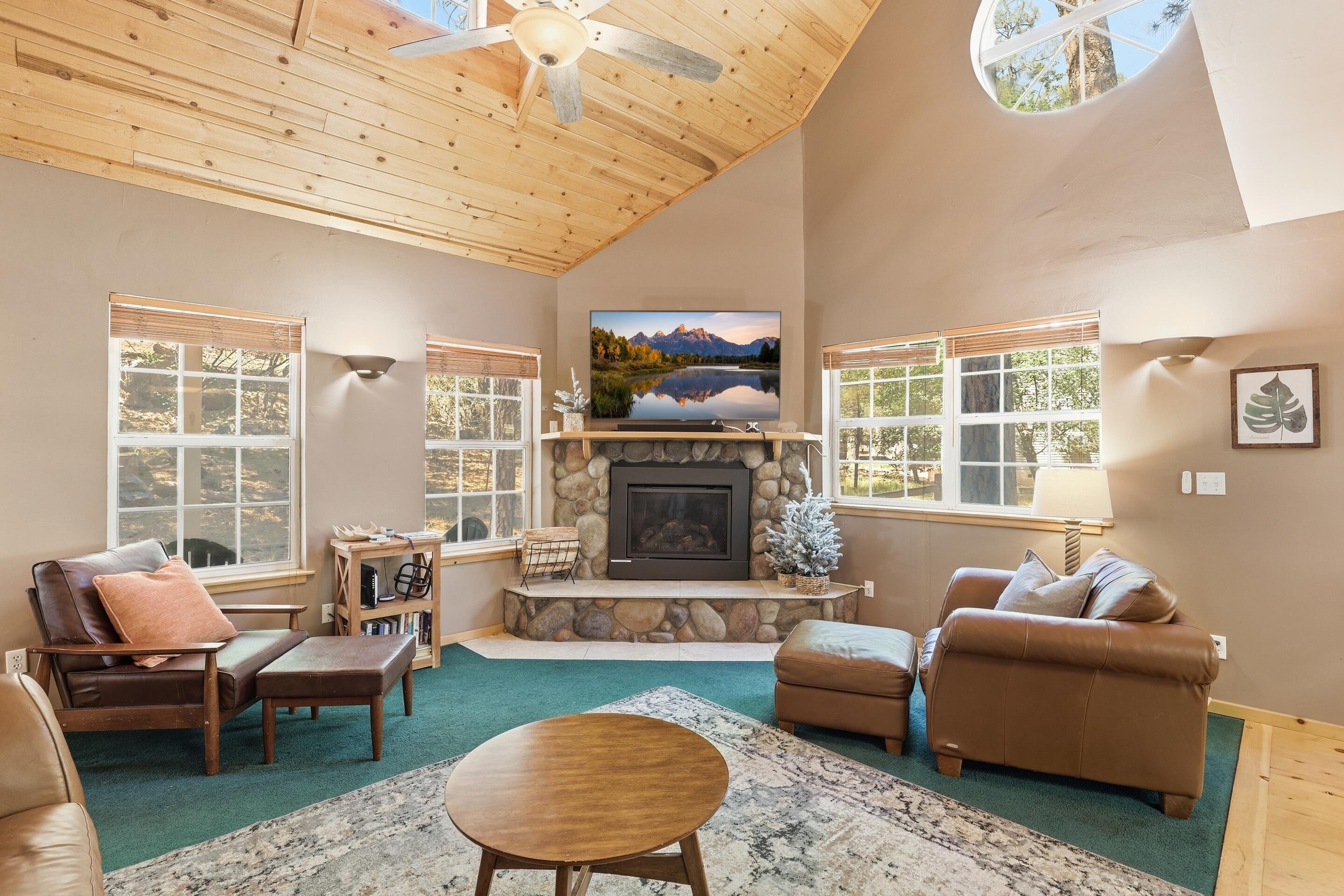 6322 Sharyn Road Pine, AZ 85544 - Photo 7 of 37 a living room with furniture a rug and a fireplace